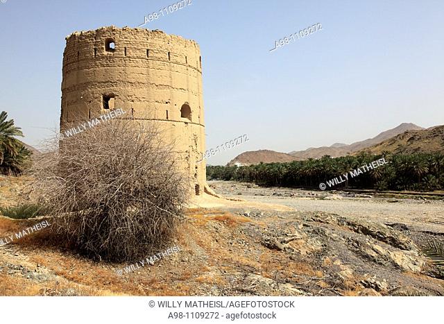 traditional old watchtower in wadi of Old Fanja, Hajar al Gharbi , Sultanate of Oman, Asia