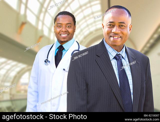 African american businessman and doctor inside medical building