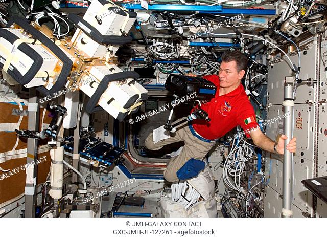 European Space Agency astronaut Paolo Nespoli, Expedition 27 flight engineer, works with Anomalous Long Term Effects on Astronauts (ALTEA) Shield isotropic...