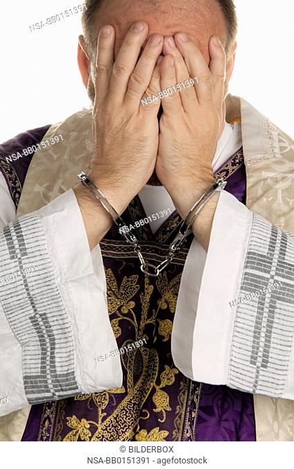 Icon image abuse in the church. Pastor handcuffed