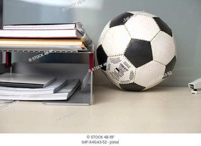 Football on the desktop besides some documents