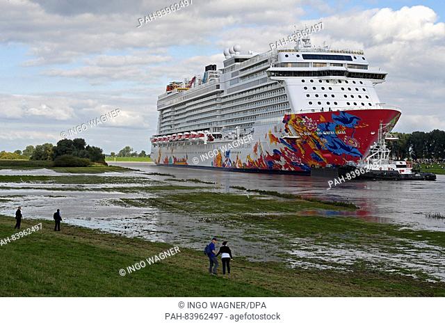 The youngest cruise ship of the Meyer shipyard ""Genting Dream"" starts its transfer sail on the narrow Ems to the North Sea in Papenburg, Germany