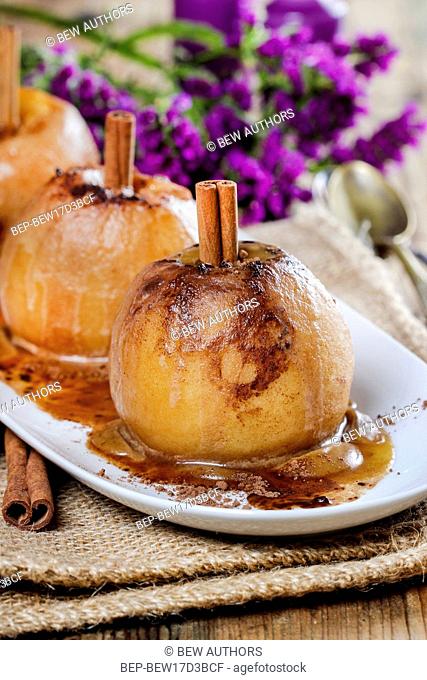 Caramel apples on wooden table. Selective focus