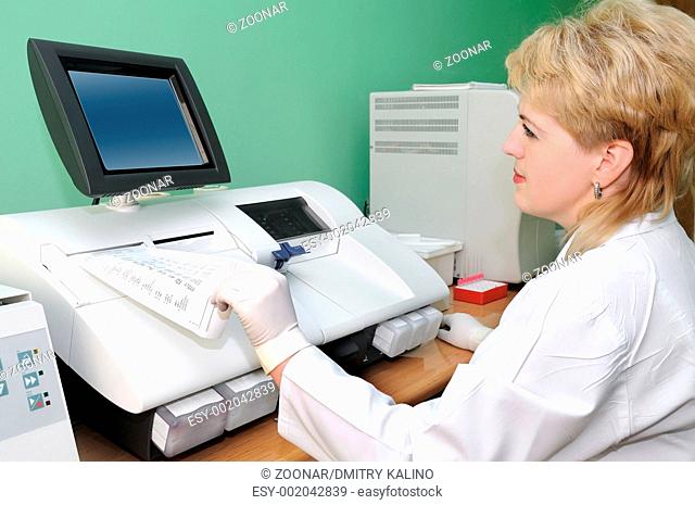 woman Scientist using medical equipment