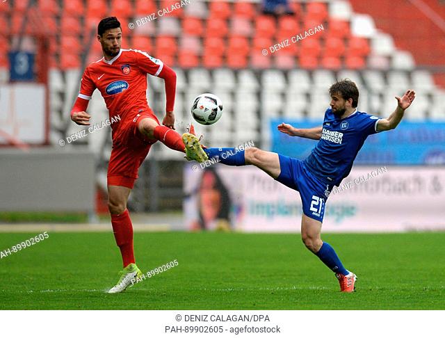 Karlsruhe's Gaetan Krebs (R) in action against Heidenheim's Tim Kleindienst (L) during the German 2nd division Bundesliga soccer match between Karlsruher SC and...