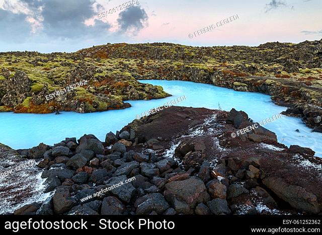 Dramatic landscape of a beautiful volcanic terrain with black volcanic rocks and turquoise water at Blue Lagoon near Grindavik in Reykjanes peninsula of Iceland
