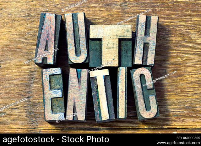 authentic word made from wooden letterpress type on grunge wood
