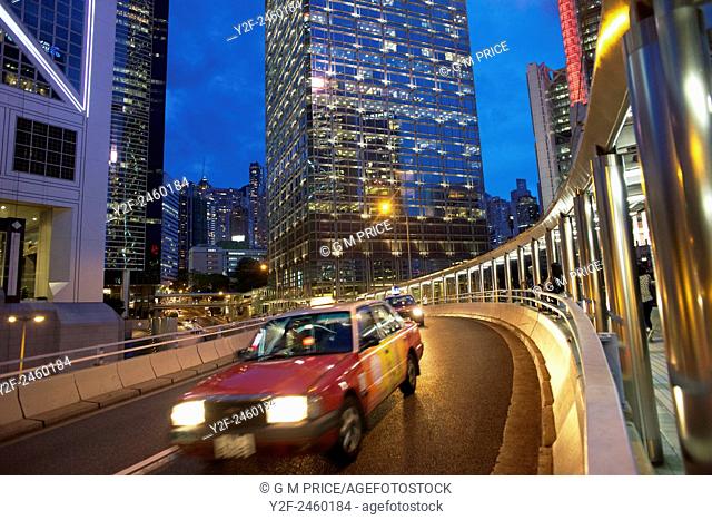 dusk traffic on curved, elevated roadway in the Admiralty district, with sections of Bank of China Tower and Chung Kong Centre buildings, Hong Kong