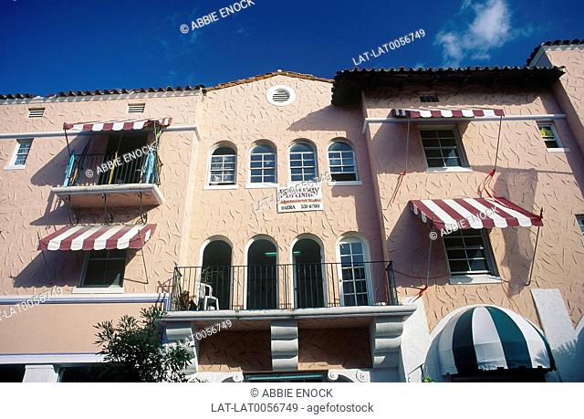 South Beach. Art Deco district. Art centre building. Mediterranean style/ colours. Awnings