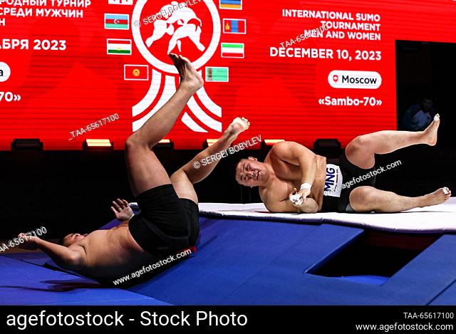 RUSSIA, MOSCOW - DECEMBER 10, 2023: Athletes Badral Baasandorj (R) of Mongolia and Sulde Dongak of Kyrgyzstan wrestle as part of the Sumo Commonwealth Cup at...