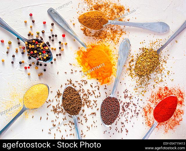 Top view mix indian spices and herbs difference on white background. Food background for design vegetable, healthy lifestyle, spices, herbs or foods content