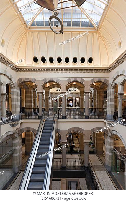 Arcades in the inner courtyard of Magna Plaza shopping centre in the former building of the Main Post Office, Nieuwezijds Voorburgwal, Amsterdam, Holland