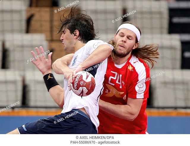 Denmarks's Mikkel Hansen (r) stops Argentina's Adrian Portela during the men's Handball World Championship 2015 Group D match between Denmark and Argentina at...