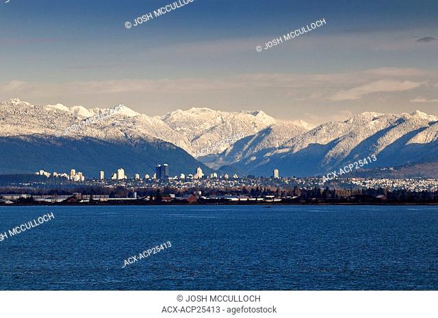 Vancouver's skyline with the snow-capped Coast Mountains behind