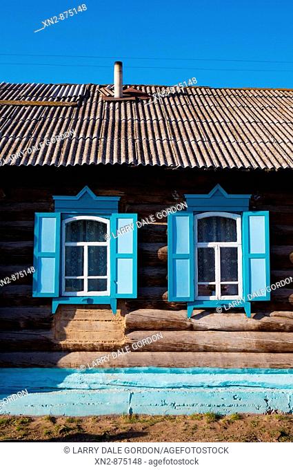 Russia. Tarbagatai Villlage of Old Believers of original Russian Orthodox. Colorful window treatment