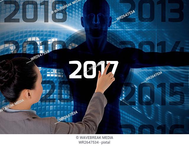 Woman touching 2017 on 3D digitally generated human body silhouette