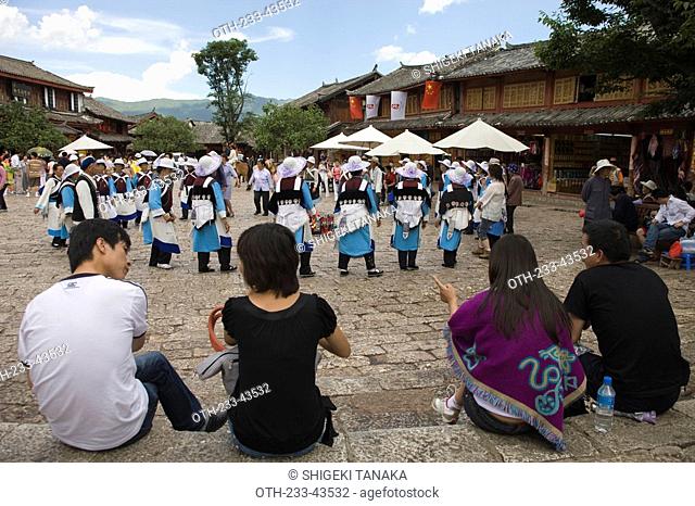 Tourists watching Naxi's folk dance, Lijiang, China