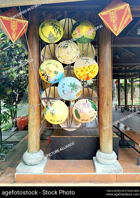 03 March 2023, Vietnam, Hue: Traditional Vietnamese hats, called Non La, are for sale for tourists at the Hue Citadel. Hue Citadel was the former residence of...