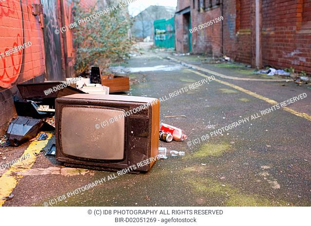 An old tv dumped in the street