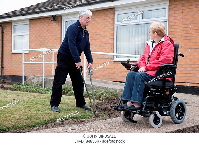 Husband and wife in adapted home gardening