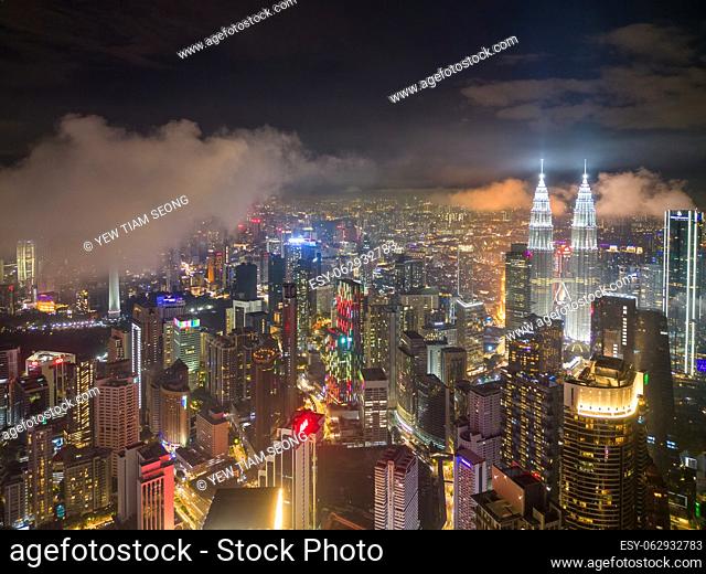 Bukit Bintang, Kuala Lumpur, Malaysia - Nov 12 2022: The KLCC twin tower's design and architecture in low cloud night