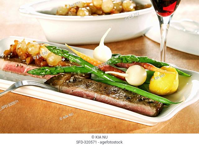 Minute steak with pearl onion sauce and vegetables