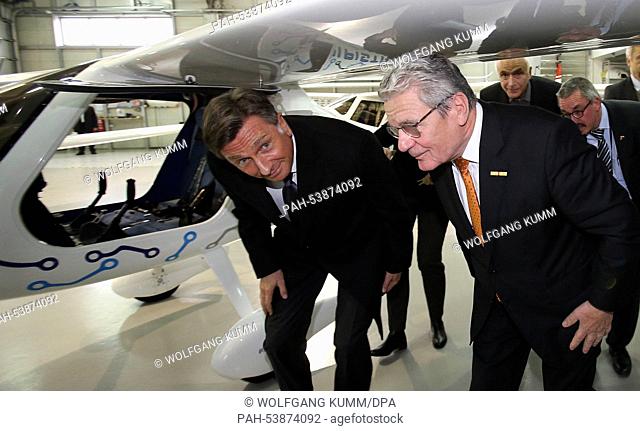 German President Joachim Gauck (R) and Slovenian President Borut Pahor (L) visit the Pipistrel airplane factory in Nova Gorica,  Slovenia, 26 November 2014