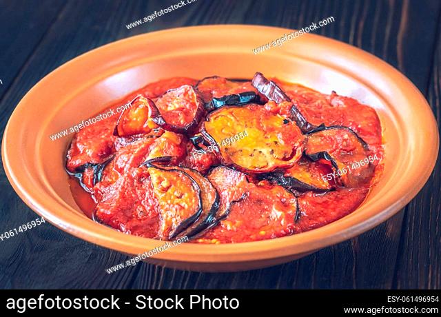Fried slices of eggplant with tomato sauce