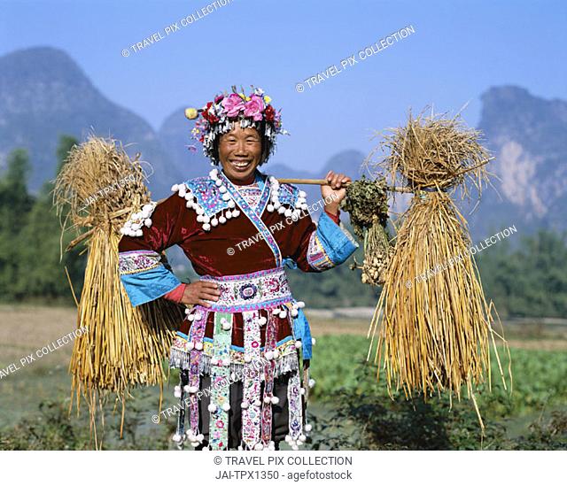 Farming Woman Dressed in Ethnic Costume, Guilin / Yangshou, Guangxi Province, China