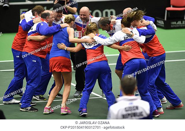 Czech tennis player Petra Kvitova (in skirt) celebrates with her team after winning the semifinal Czech Republic vs. France Fed Cup match against Caroline...