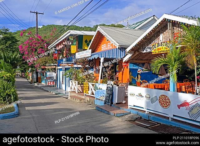 Main street with colourful shops and restaurants in capital town Port Elizabeth on the island Bequia, Saint Vincent and the Grenadines, Caribbean