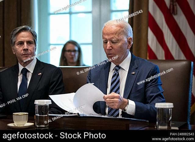 United States President Joe Biden looks over his notes as US Secretary of State Antony Blinken, listens during a cabinet meeting at the White House in...