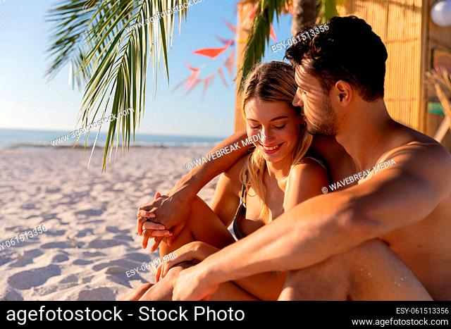 Caucasian couple enjoying time at the beach