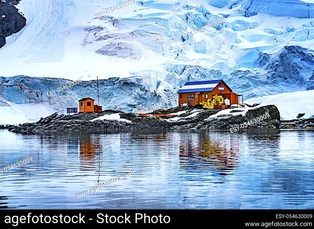 Snowing Argentine Almirante Brown Station Blue Glacier Mountain Paradise Harbor Bay Antarctic Peninsula Antarctica. Glacier ice blue because air squeezed out of...
