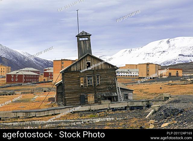 Derelict wooden building with tower at Pyramiden, abandoned Soviet coal mining settlement on Svalbard / Spitsbergen