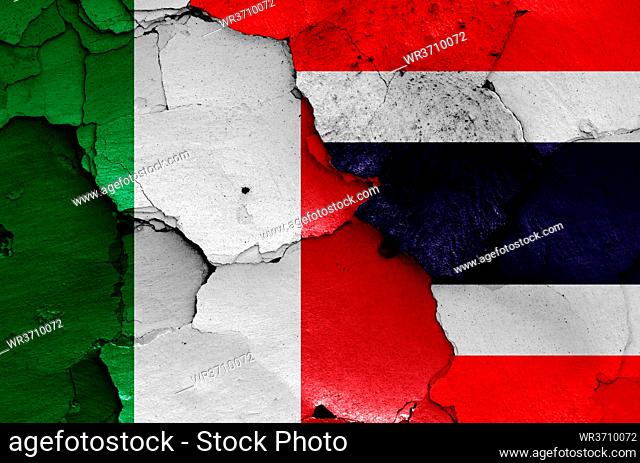 flags of Italy and Thailand painted on cracked wall