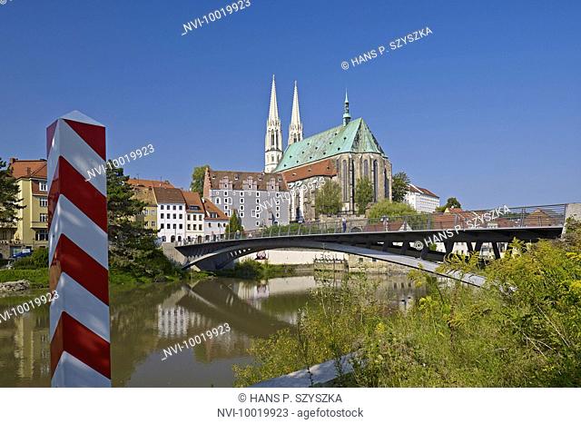 Bridge over the Neisse River to old town with Church of St. Peter and Paul in Görlitz, Saxony, Germany