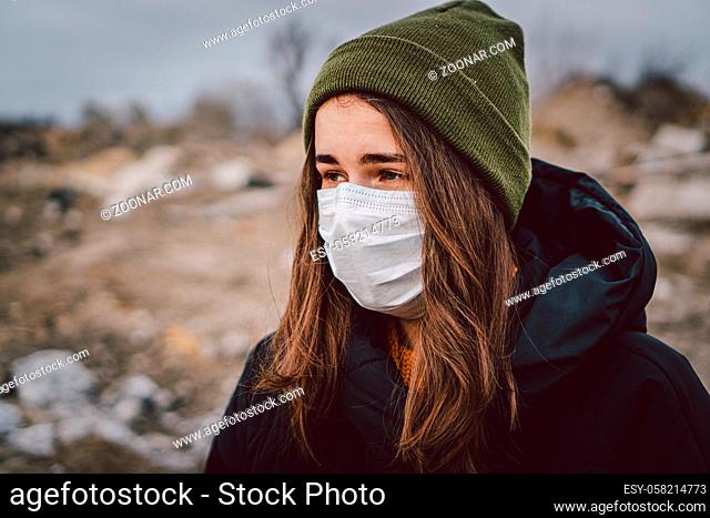 Portrait of young woman wearing medical mask, health protection from influenza virus, epidemic and infectious diseases. Protect your health