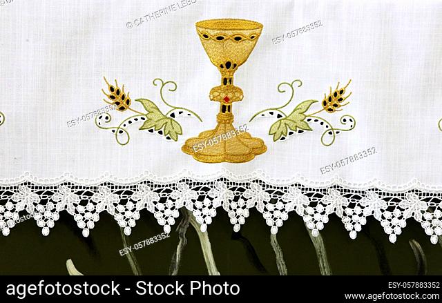 Chalice embroidered on the altar tablecloth. St. Nicholas and St. Mark Church. City of Avray. Haut-de-Seine. France. Europe