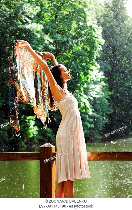 Girl stay under rain drops cover shawl
