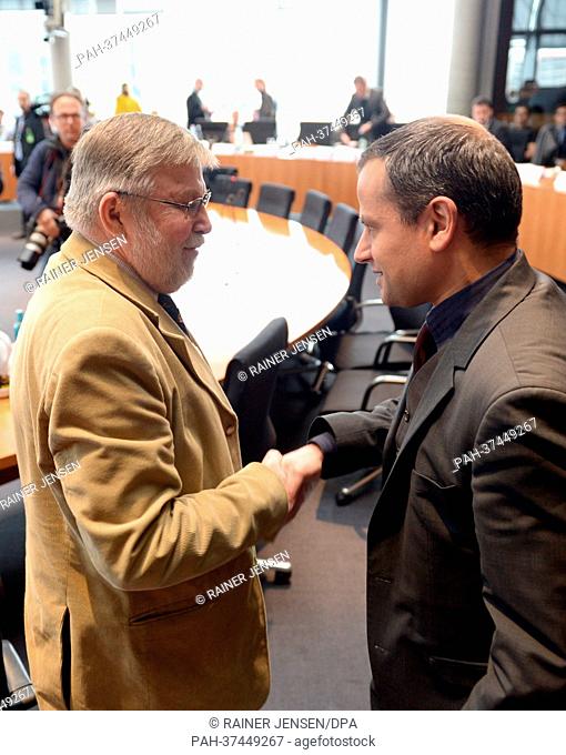 Former Vice-President of the Thuringian Agency for the Protection of the Constitution Peter-Joerg Nocken (L) shakes hands with committee chairman Sebastian...