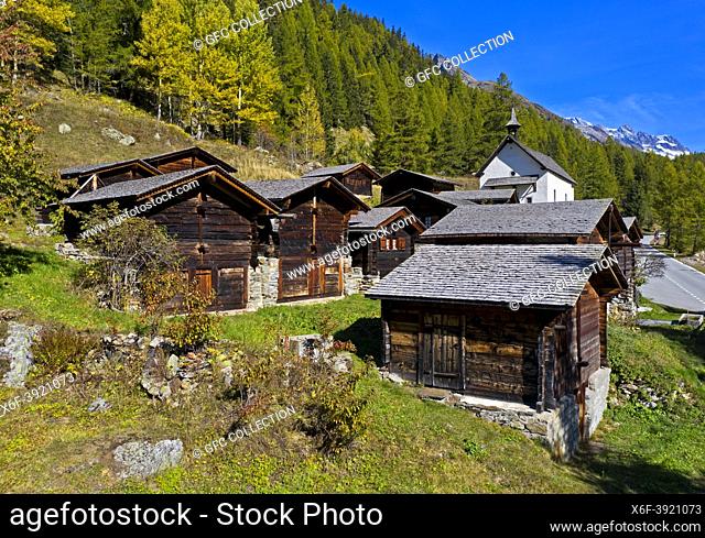 Wooden stables and storage houses in the hamlet Kühmad near the pilgrimage chapel, view at the Loetschenluecke Pass, Blatten, Lötschental, Valais, Switzerland