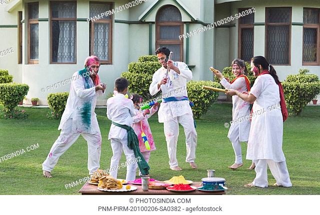 Family celebrating Holi