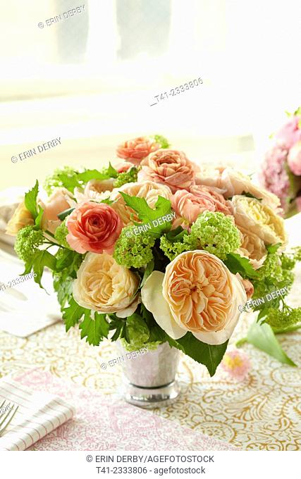 A bouquet of flowers on a set table