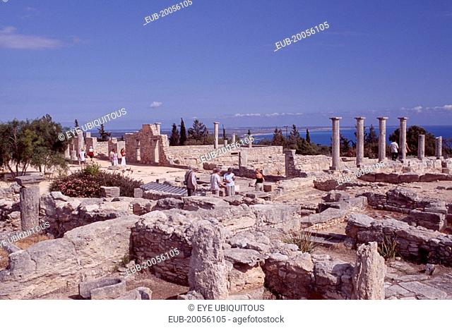 Sanctuary of Apollo Hylates and tourists with sea beyond