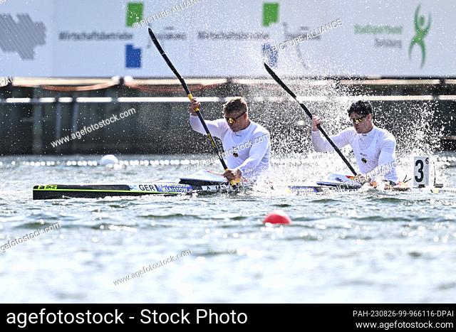 26 August 2023, North Rhine-Westphalia, Duisburg: Canoe: World Championship, decision, final, kayak double, 1000m, men. Anton Winkelmann and Leonard Busch from...