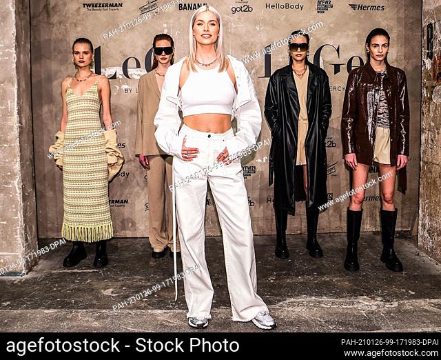 24 January 2021, Berlin: Lena Gercke (front) and models show creations by LeGer by Lena Gercke at About You Fashion Week at Kraftwerk Berlin