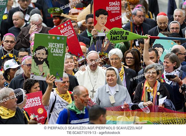 Pope Francis in procession with Bishops, Cardinals and Amazonian natives from the St. Peter Basilica to the Paul VI Hall during the opening ceremony for the...