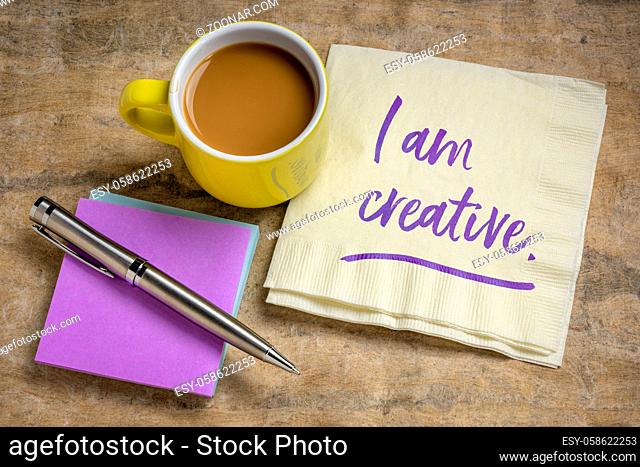 I am creative positive affirmation - handwriting on a napkin with coffee, creativity and personal development concept