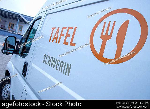 16 February 2023, Mecklenburg-Western Pomerania, Schwerin: The logo of the Schwerin Tafel on one of the small trucks used to transport the food